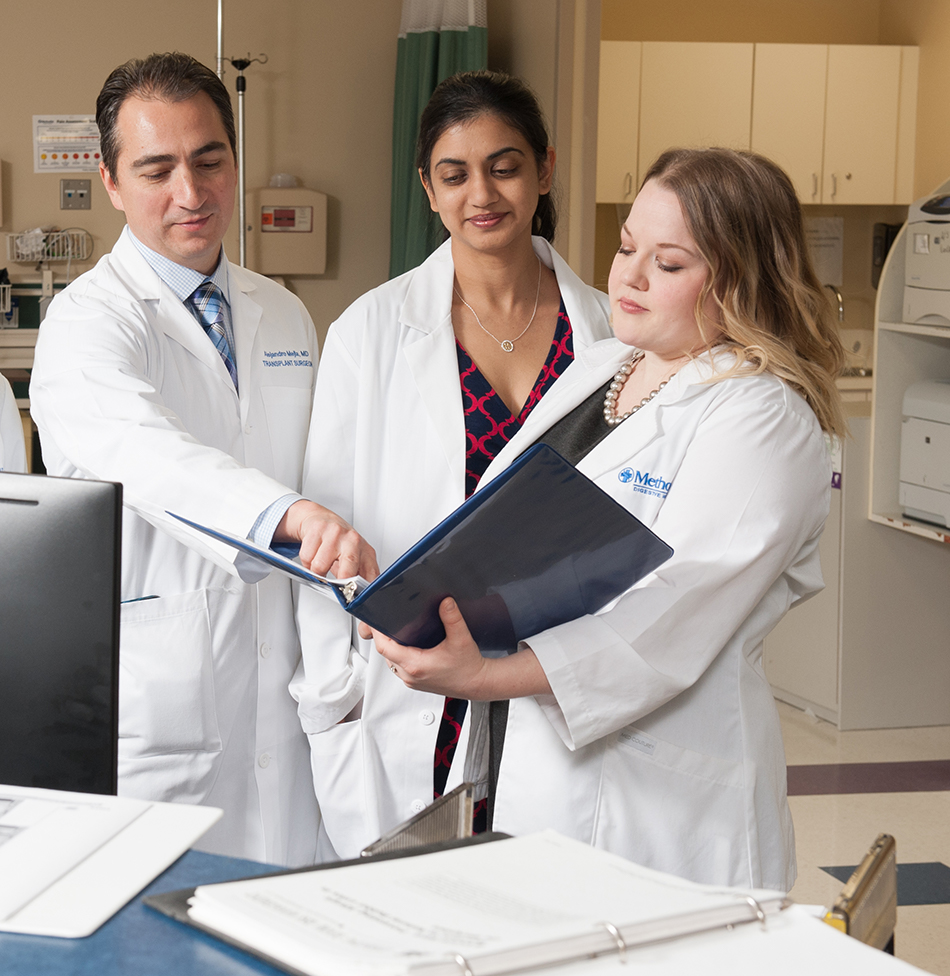 Doctors looking over paperwork together